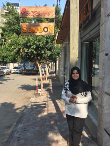 Sun Box entrepreneur Majd Mashharawi in front of her office/shop premises in Gaza City (photo: Inge Gunther)