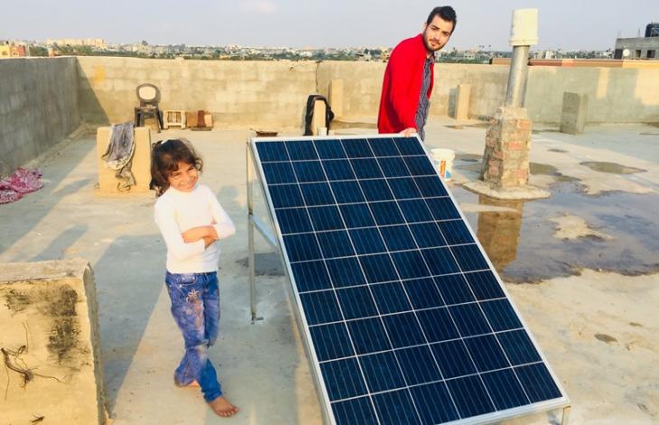 Mograka residents admire one of the new solar panels (photo: Inge Gunther)