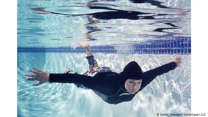 A Muslim woman swims in a hijab full body swimsuit (photo: Shereen Sabet/Splashgear LLC)