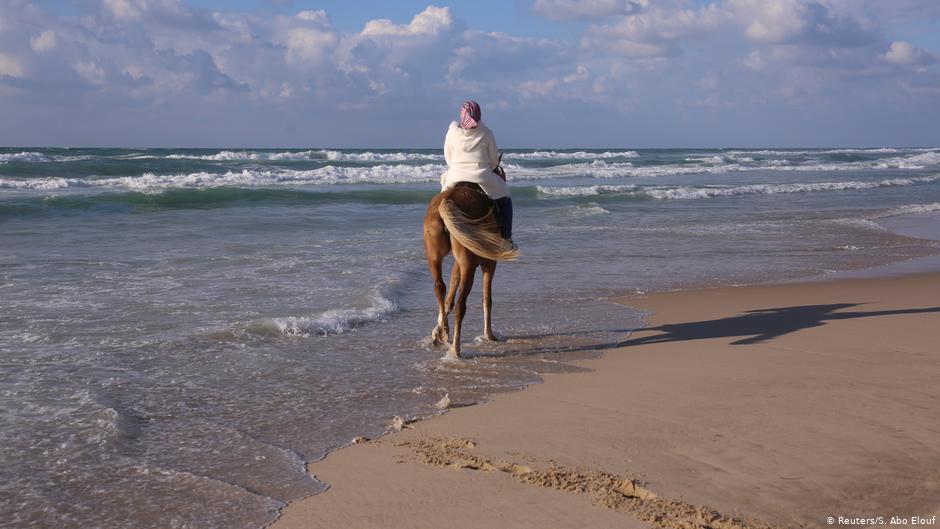 Suad Dawood rides a horse on a beach in Gaza City (photo: Reuters/Samar Abo Elouf)