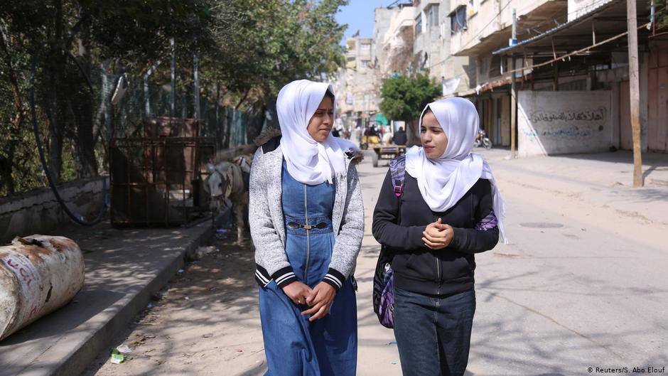 Wessal Abu Amra (right) and a schoolfriend walk in Gaza City (photo: Reuters/Samar Abo Elouf)