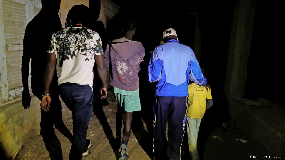  Mamadou Gueye (second right), a street child educator, and Issa Kouyate (left), founder of Maison de la Gare, an organisation that helps talibe street children reintegrate into society, escort an eight-year-old talibe boy and a teenager (green shorts) during a night patrol in Saint-Louis, Senegal, on 9 February 2019. Gueye and Kouyate rescued the boy when the teenager was raping him at a bus station (photo: Zohra Bensemra)