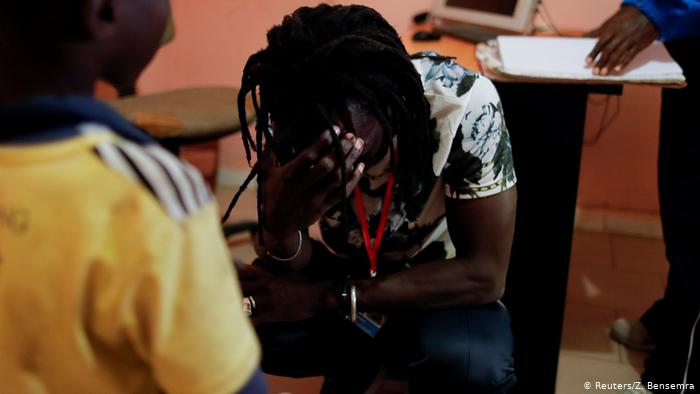 Issa Kouyate cries while talking to the boy who was raped (photo: Zohra Bensemra)