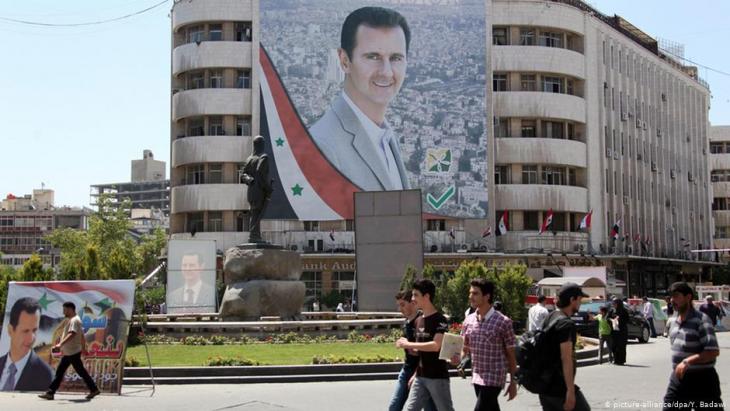 Portrait of Bashar al-Assad on Al-Mohafazah Square in Damascus (photo: dpa/picture-alliance)