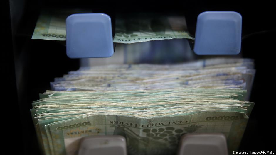 Lebanese currency is counted on a machine at a currency exchange shop in Beirut, Lebanon (photo: AP Photo/Hussein Malla)