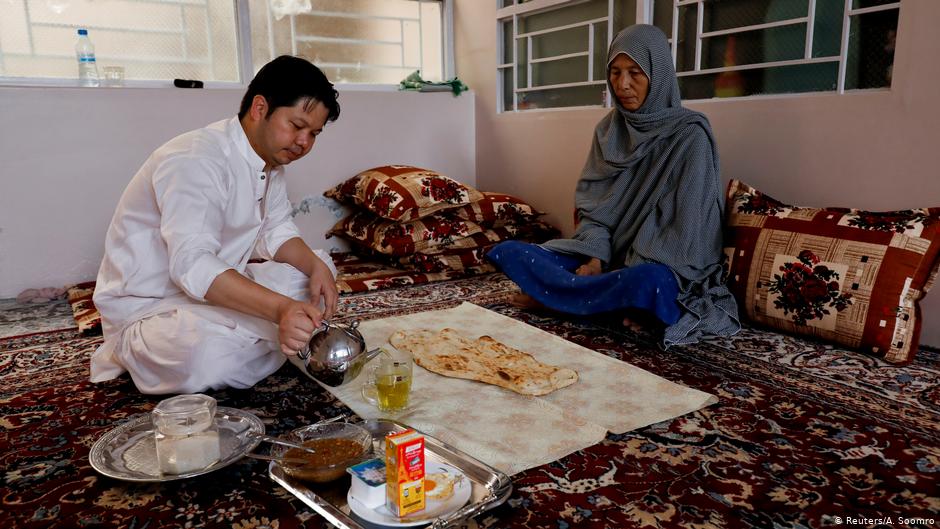 Sardar Sahil, 30-year-old Hazara lawyer and rights activist, eats his breakfast with his mother at his home in Hazara Town, Quetta (photo: Reuters/A. Soomro)