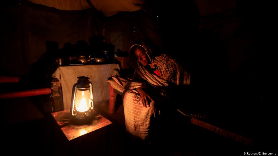 Manal, who was displaced from her home when the Nile river overflowed in September 2019, sits inside her tent in Wad Ramli, Sudan, 19 February 2020 (photo: REUTERS/Zohra Bensemra)