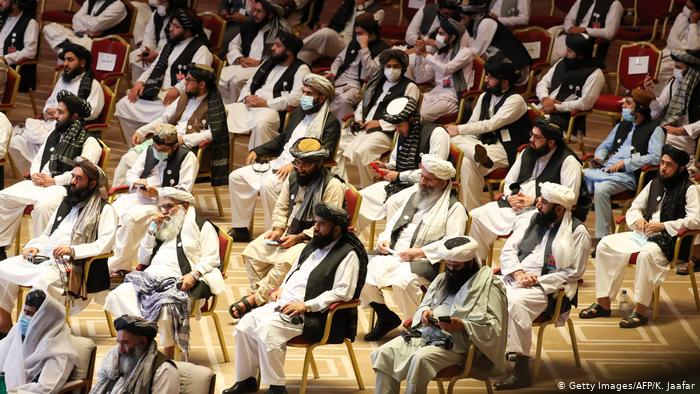 Members of the Taliban delegation attend the opening session of the peace talks between the Afghan government and the Taliban in Doha, Qatar, 12 September 2020 (photo: Getty Images/AFP/K. Jaafar)