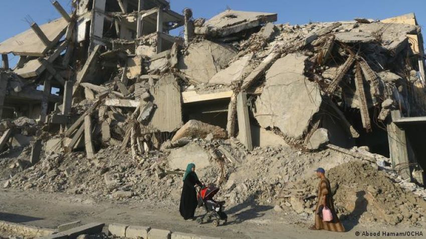 Searching for memories in the rubble of Raqqa: a woman pushes a stroller through the destroyed landscape of Raqqa in this photograph from 2019. "I was shocked by what happened to my city, in which I have memories in every street," the photographer Abood Hamam says. "They destroyed everything connected to our past and memory with our life in the city, every detail that used to connect me to it. It was so painful"