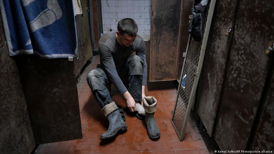 A Bosnian coal miner changes into his work outfit at a mine in Zenica, Bosnia, 29 April 2021 (photo: AP Photo/Kemal Softic)
