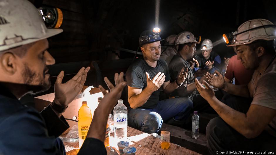 Bosnian coal miners pray after breaking fast in the underground at a mine in Zenica, Bosnia, 29 April 2021 (photo: AP Photo/Kemal Softic)