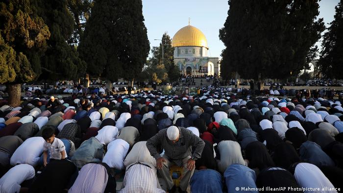 Muslims take part in Eid prayers in the Al-Aqsa Mosque compound in Jerusalem