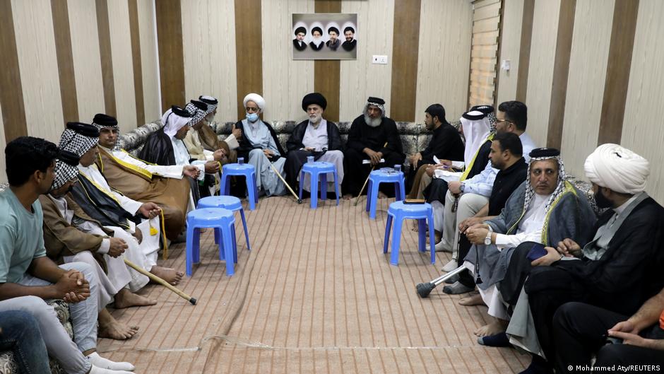 Cleric Hazem al-Aaraji (centre), a senior aide to Muqtada al-Sadr, meets with people in Basra, Iraq 25 May 2021 (photo: Mohammed Aty/Reuters)