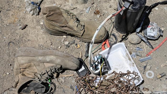Shoes, wire and other U.S. waste on Bagram scrapyard