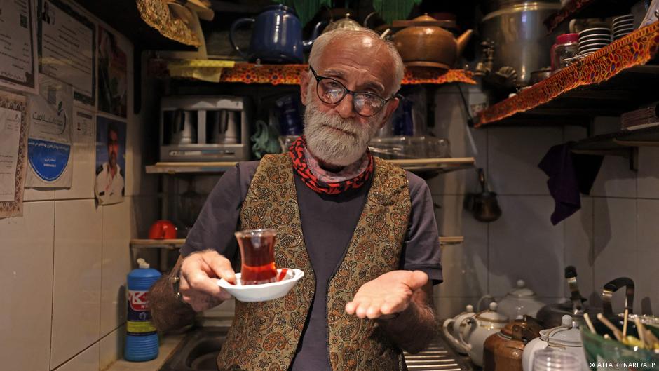Owner Kazem Mabhutian, 63, serves tea at the smallest and oldest teahouse tucked away in an alleyway of the Grand Bazaar in the Iranian capital Tehran on 20 September 2021 (photo: Atta Kenare/AFP)