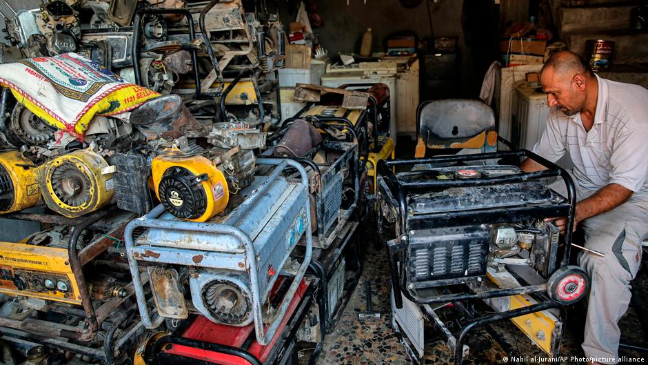 A worker repairs generators at his shop in Basra, Iraq, Tuesday, 29 July 2021 (photo: AP Photo/Nabil al-Jurani)