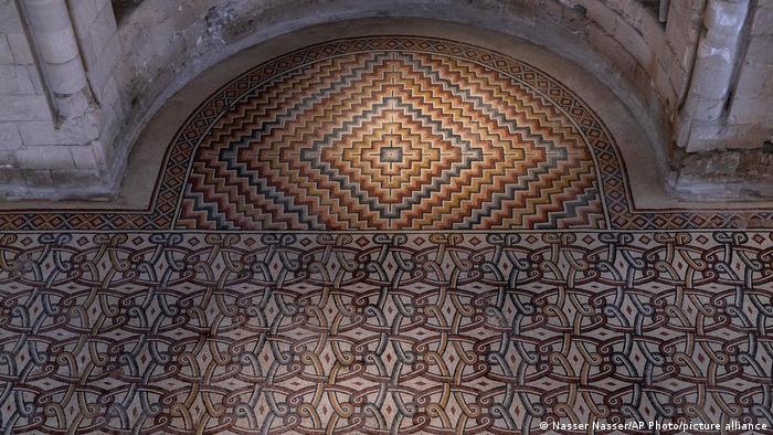 Intricate floor mosaics inside the palace