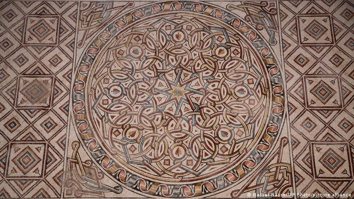 Intricate geometric patterns on a floor mosaic