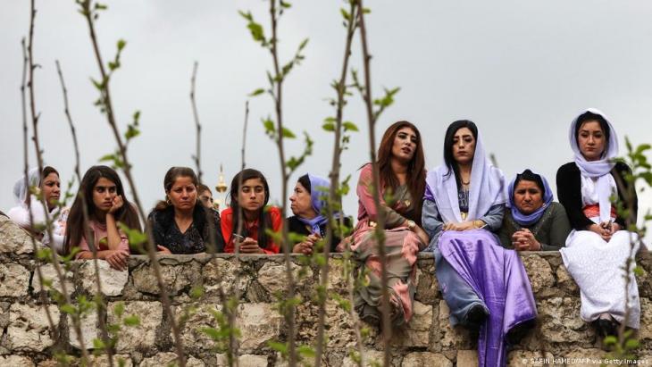 Yazidi women on the sidelines of a New Year celebration in Dohuk 2019 (photo: SAFIN HAMED/AFP via Getty Images)