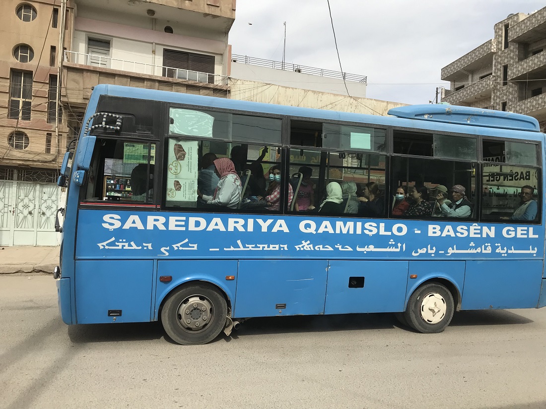 Bus bearing multilingual signs in Qamishli in north-eastern Syria (photo: Kristin Helberg)