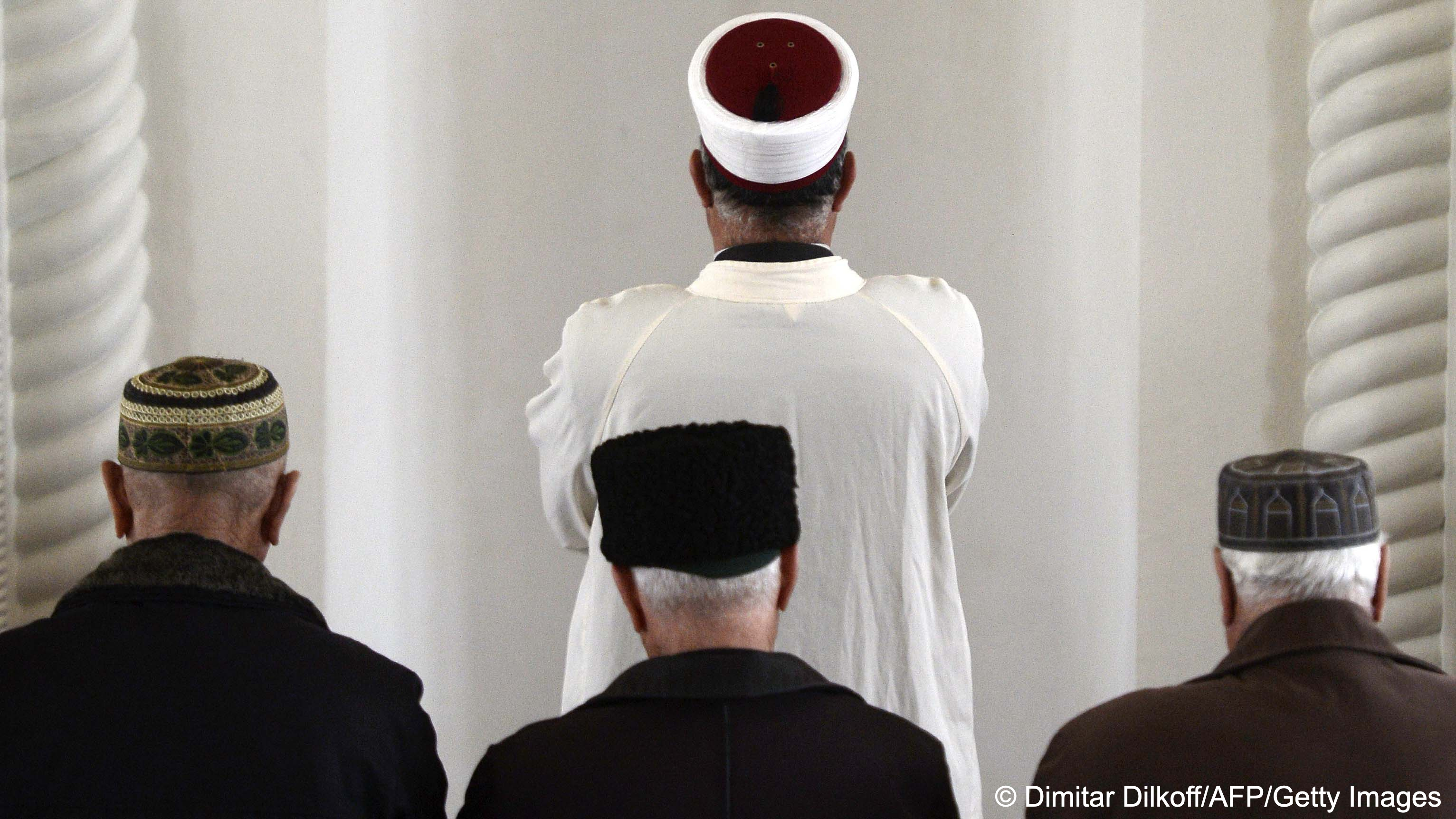 Crimean Tatar men pray at a mosque in Bakhchysarai. 