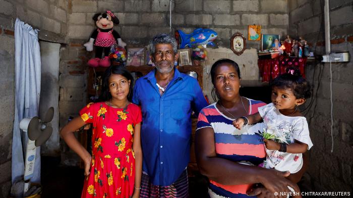 A fisherman and his family in Negombo, Sri Lanka, 16 April 2022 (photo: Reuters/Navesh Chitrakar)