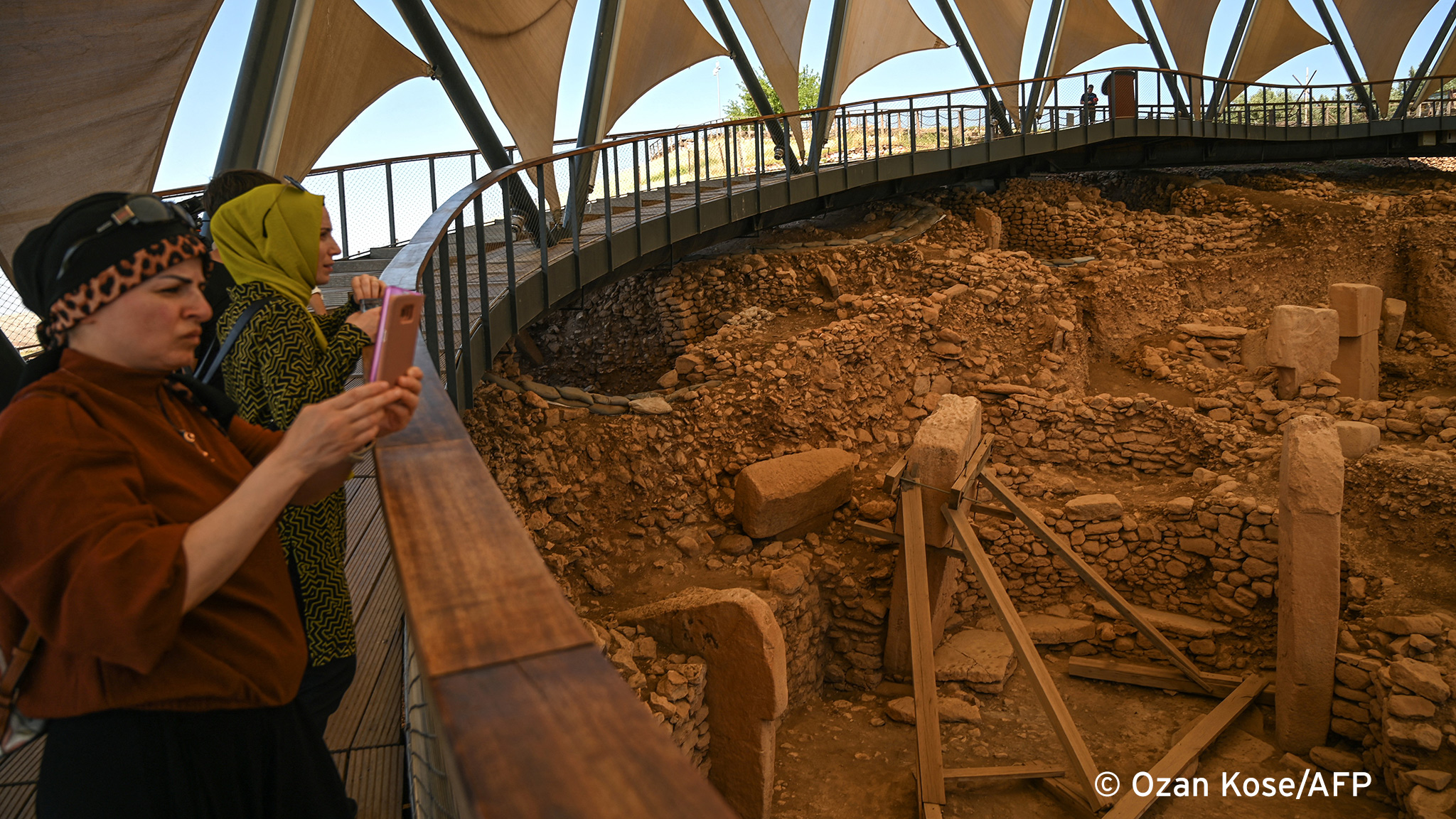 Major draw: Visitors take pictures at the archaeological site of Gobekli Tepe near Sanliurfa, Turkeyn (photo: Ozan KOSE/AFP) 