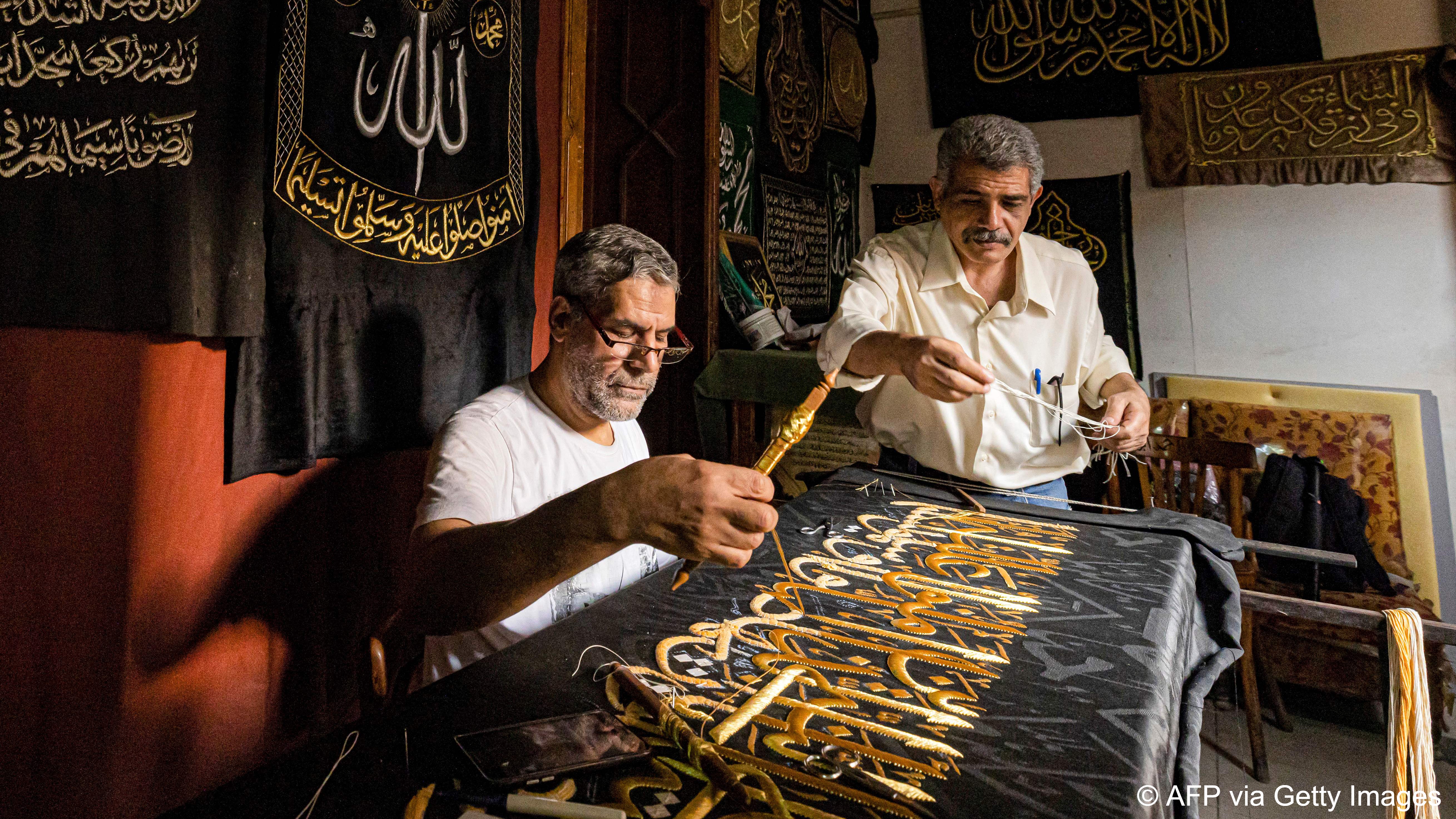 Egyptian artisan Ahmed Othman has kept alive a family tradition of embroidering replicas of the kiswa in gold nearly a century after it was entrusted to him (photo: Khaled DESOUKI/AFP) 