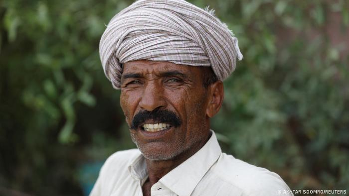 Mulazim Hussain, 61, is proud of the trees he has planted (photo: Reuters)