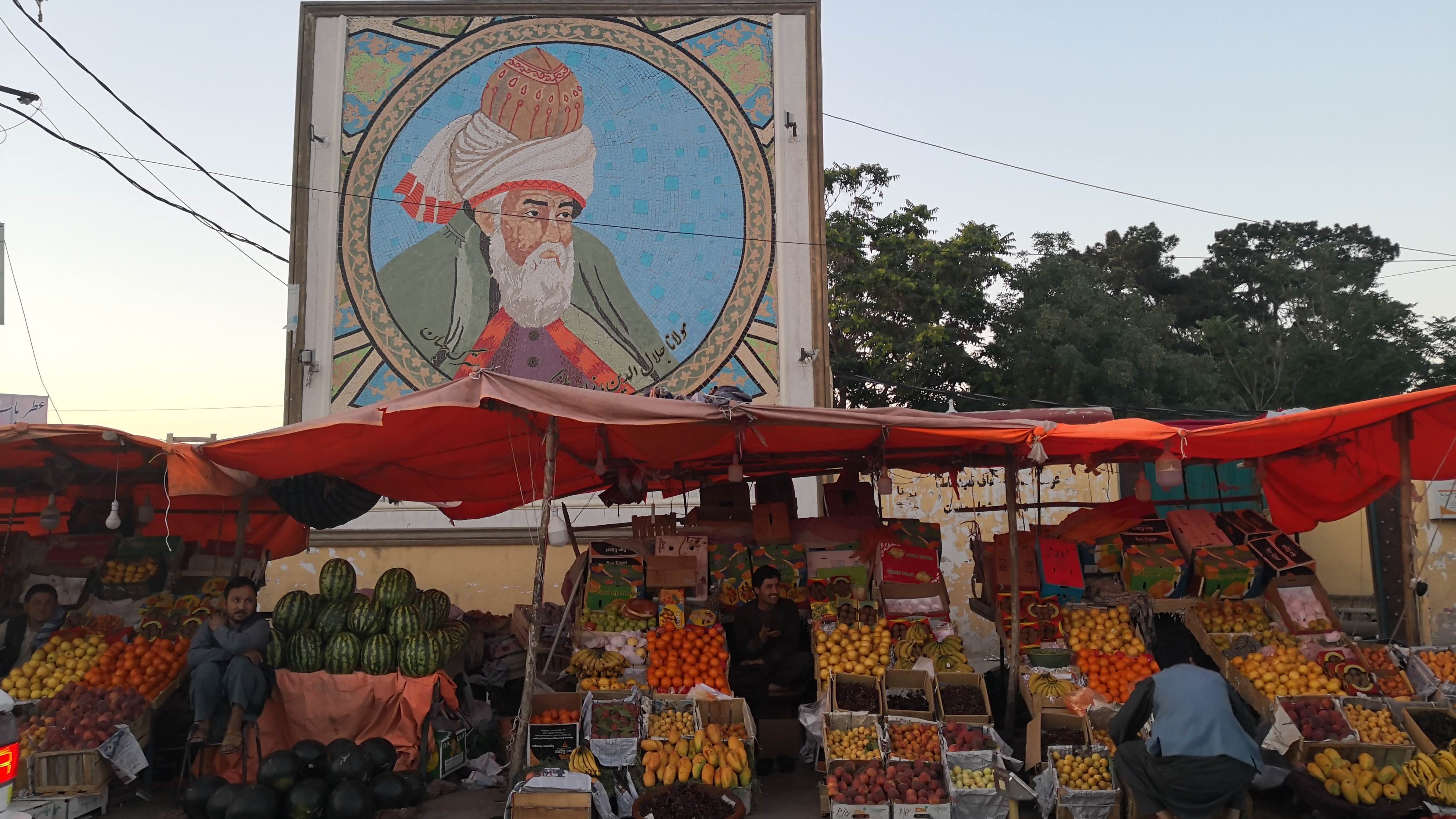 An image of Rumi above a market stall (photo: Marian Brehmer)