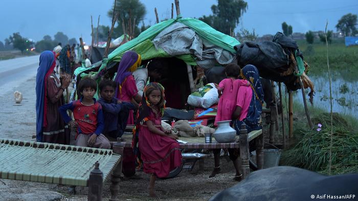 Flood affected people take shelter at a makeshift camp