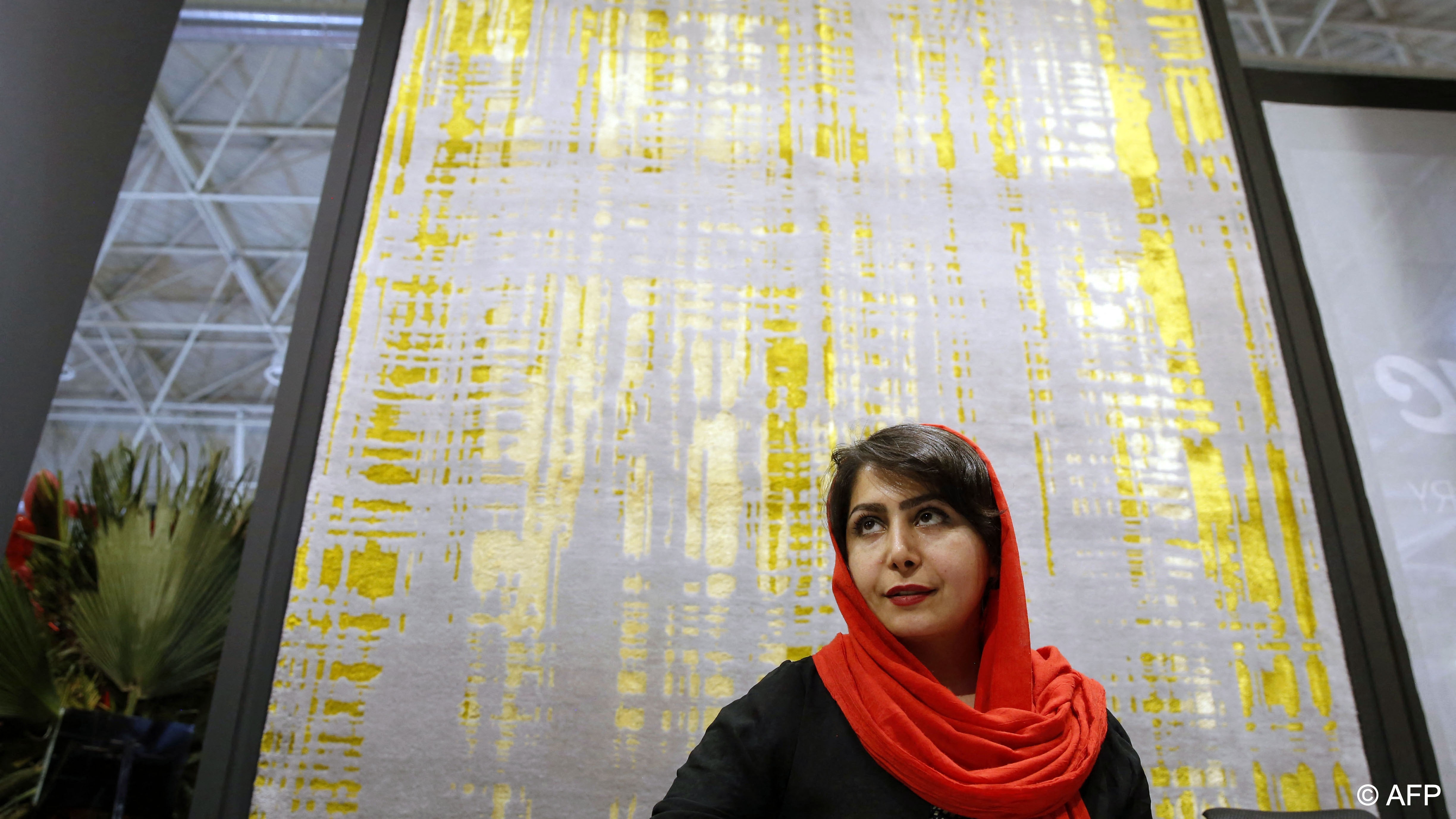 This wool rug looks as if an ink roller has left splashes of gold on it (photo: AFP)