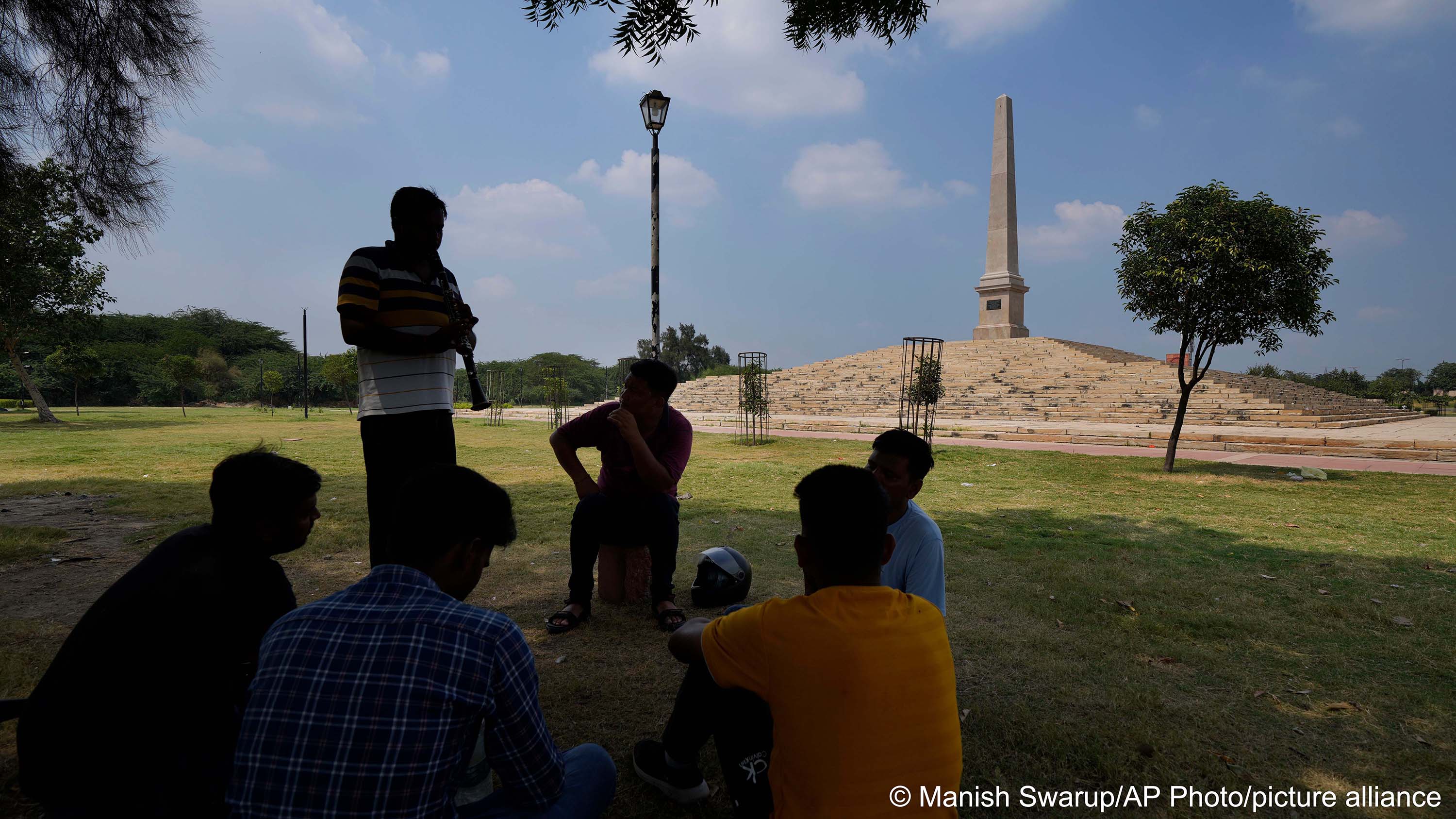 A group of band players practise in front of Proclamation tower at the Coronation Park, which houses statues of old British Kings and rulers in New Delhi, 11 September 2022 (photo: AP Photo/Manish Swarup)