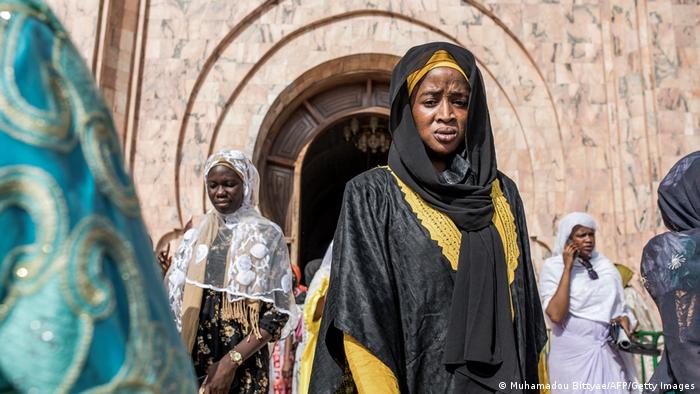 Female pilgrims exit the Great Mosque of Touba