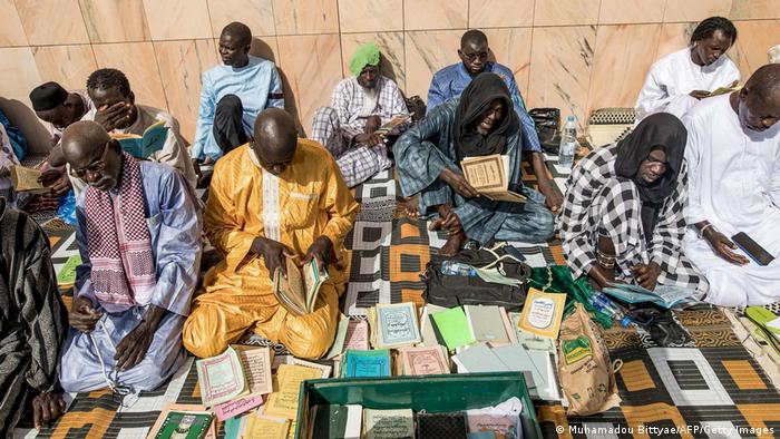 Members of the Mouride brotherhood read religious texts