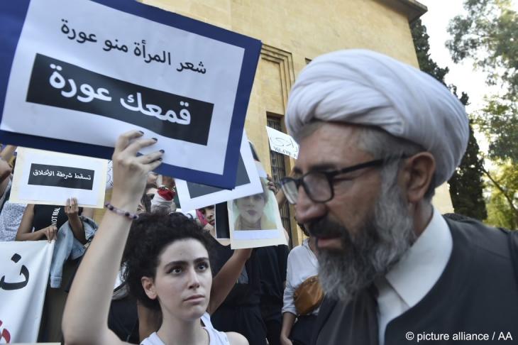 A Shia man, who disagreed with the protesters, is sent away as Lebanese activists take part in a demonstration in support of women protesters in Iran, following the death of Mahsa Amini, outside the Lebanese National Museum in Beirut, Lebanon, 2 October 2022 (photo: picture alliance/AA/Hussam Shbaro)  
