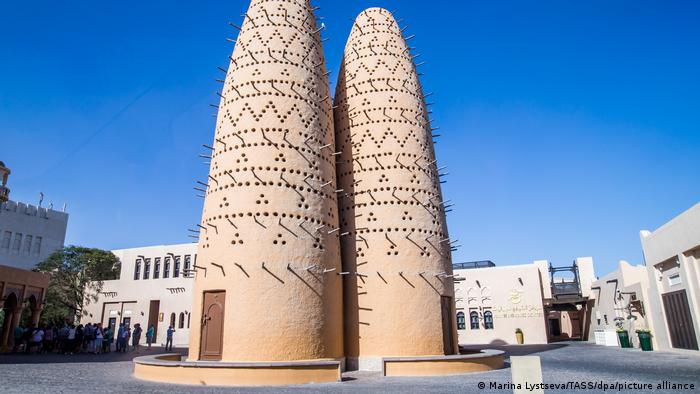Two traditional beige colored towers in the center of Katara Cultural Village