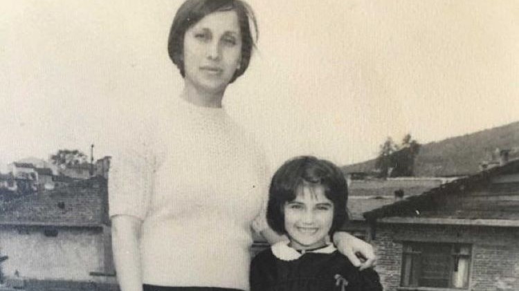 Canan Topcu in 1972 in Turkey, shortly before her migration to Germany. She stands beside her class teacher on the school grounds in Gemlik, south of Istanbul.
