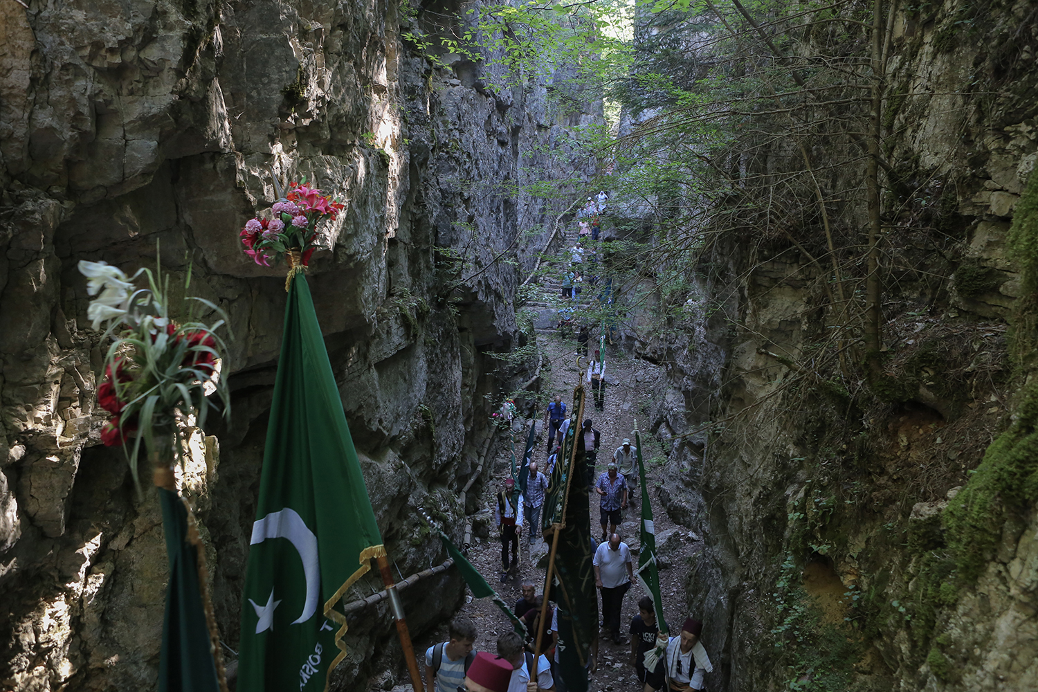 Pilgrims move through the rocky wooded chasm (photo: Konstantin Novakovic)
