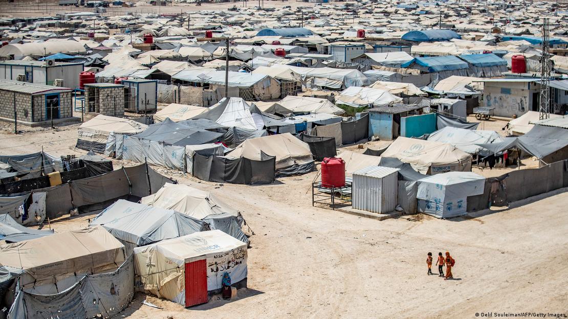 Children walking between shelters at al-Hol camp, Syria, 2 August 2021 (photo: Delil Souleiman/AFP/Getty Images)
