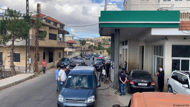 Cars and people wait near petrol pumps on a street in Rechaya, Lebanon (photo: Taghreed Talk)