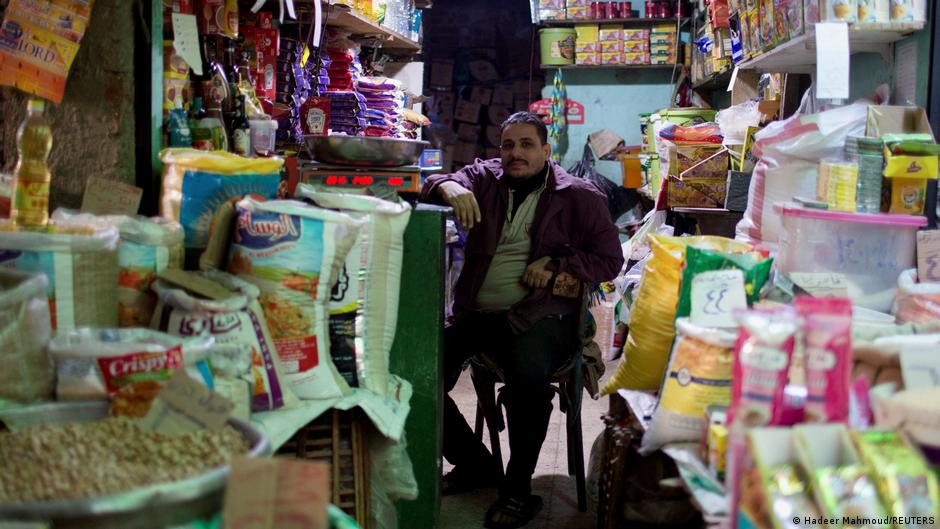 Egyptian grocer in his shop (image: Hadeer Mahmoud/REUTERS)