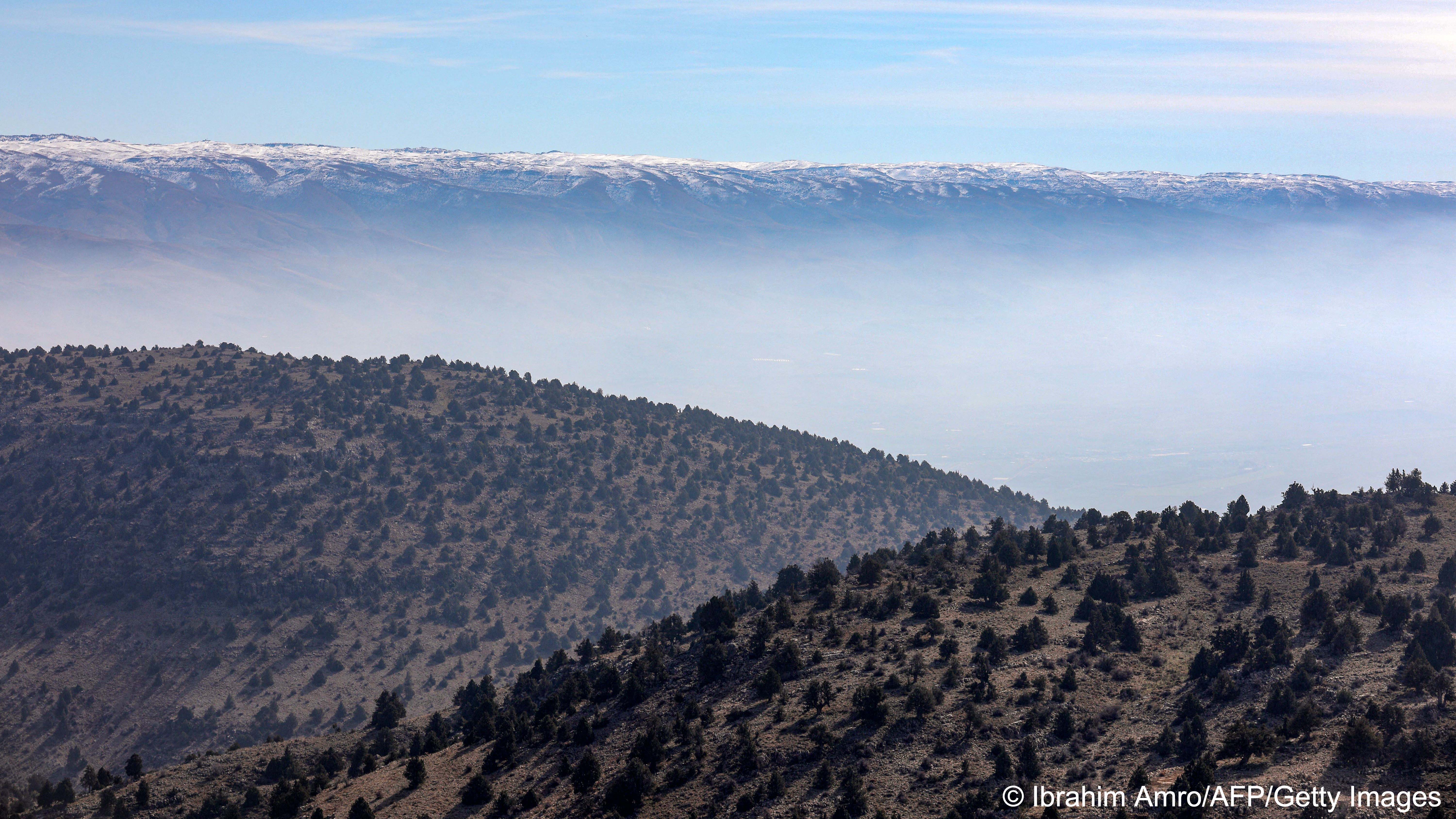 Forested slopes wreathed in low cloud (image: Ibrahim AMRO/AFP)