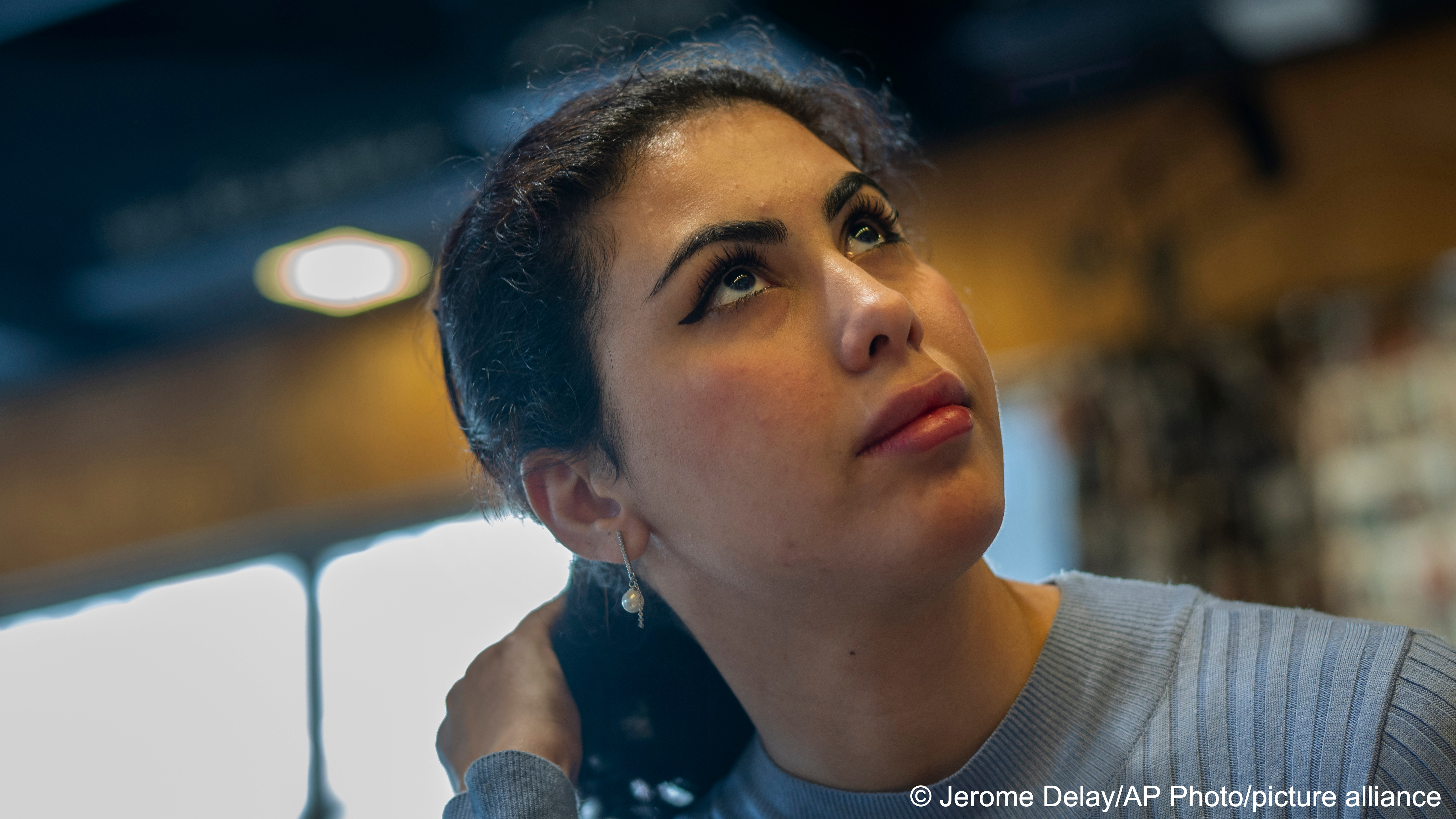 Noor Alhuda Saad, 26, a Ph.D. candidate at Mustansiriya University who  describes herself as a political activist, sits in a Baghdad cafe on Wednesday,  March 1, 2023. She says her generation has been leading protests decrying  corruption, demanding services and seeking more inclusive elections -- and  won’t stop till they’ve built a better Iraq. “The people in power do not see  these as important issues for them to solve. And that is why we are active” (image: AP Photo/Jerome Delay)
