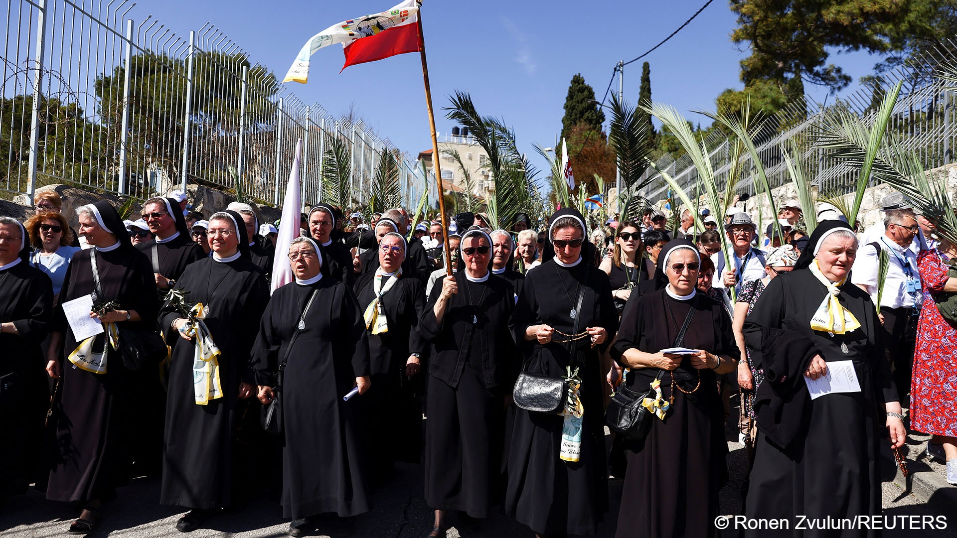 Nuns and other Christian worshippers attend a Palm Sunday procession on the Mount of Olives in Jerusalem, 2 April 2023 (image: REUTERS/Ronen Zvulun)