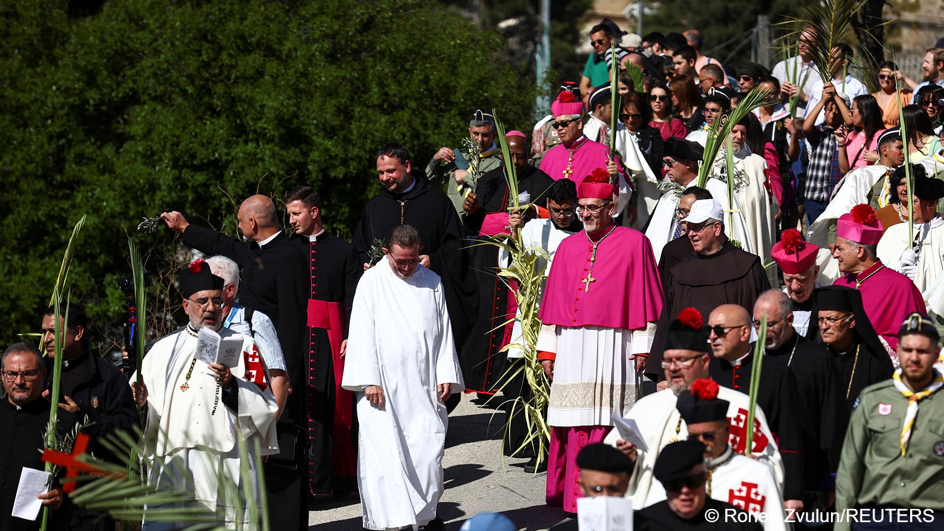 Latin Patriarch of Jerusalem Pierbattista Pizzaballa leads a Palm Sunday procession on the Mount of Olives in Jerusalem, 2 April 2023 (image: REUTERS/Ronen Zvulun)