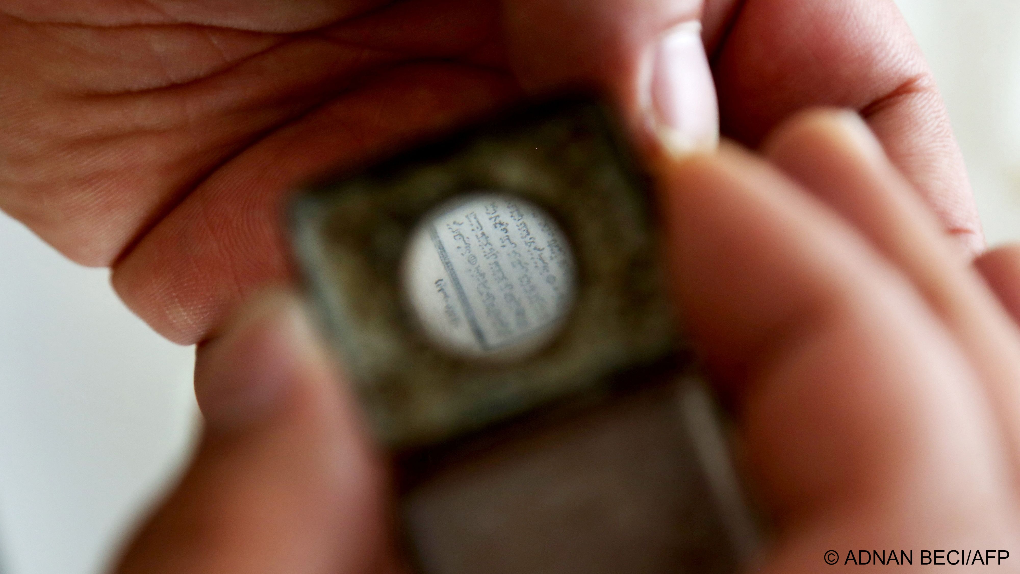  The Arabic text can only be read with a small magnifying glass embedded in the Koran's case (image: Adnan Beci/AFP) 