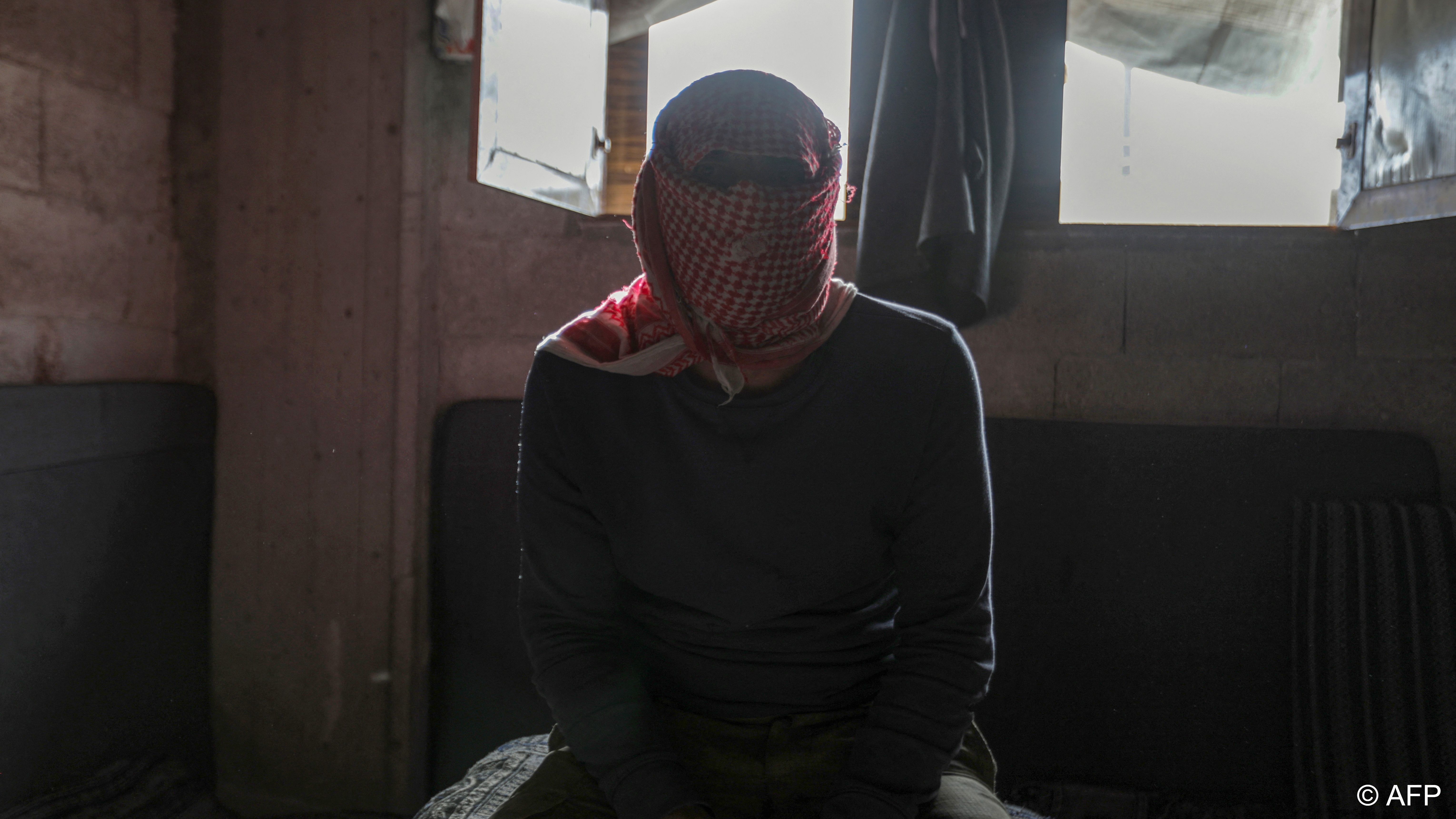 A captagon dealer masks his face with a traditional keffiyeh scarf before an AFP interview in Aleppo, Syria (image: AFP)