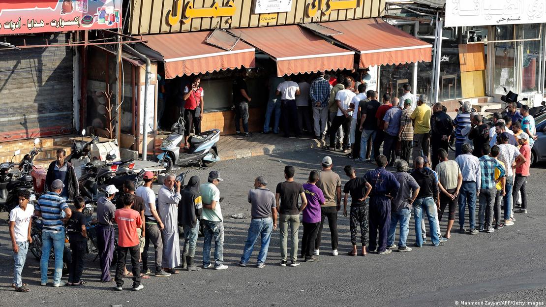 People queue for bread in Lebanon (image: Mahmoud Zayyat/AFP/Getty Images)