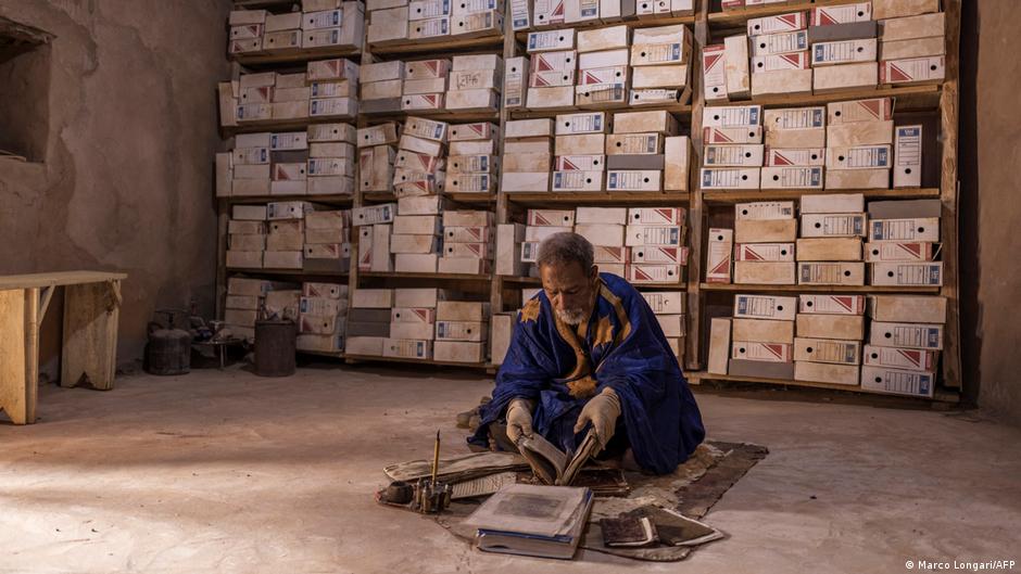 A man sits in one of the rooms where some of the 700 manuscripts privately owned by his family are preserved in Chinguetti